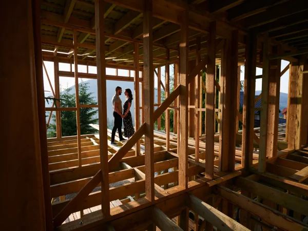 man-and-woman-inspecting-their-future-wooden-frame-2026-03-17-02-13-27-utc